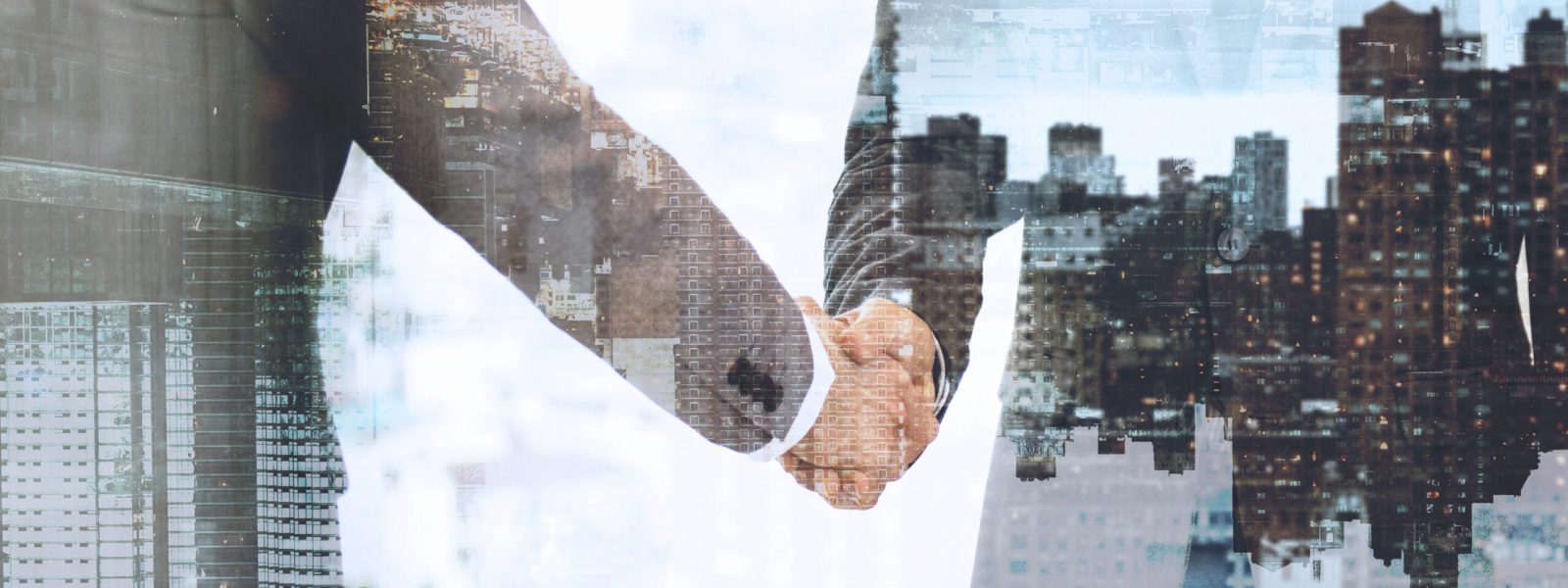 Corporate business handshake between business partners Corporate business handshake between business partners